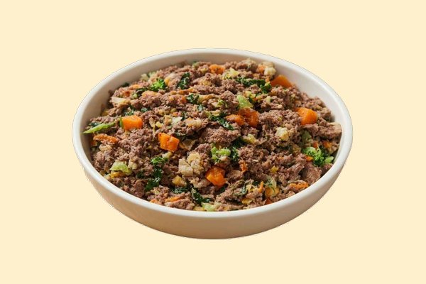 A bowl of cooked ground kangaroo with kale, carrots, butternut squash and brown rice