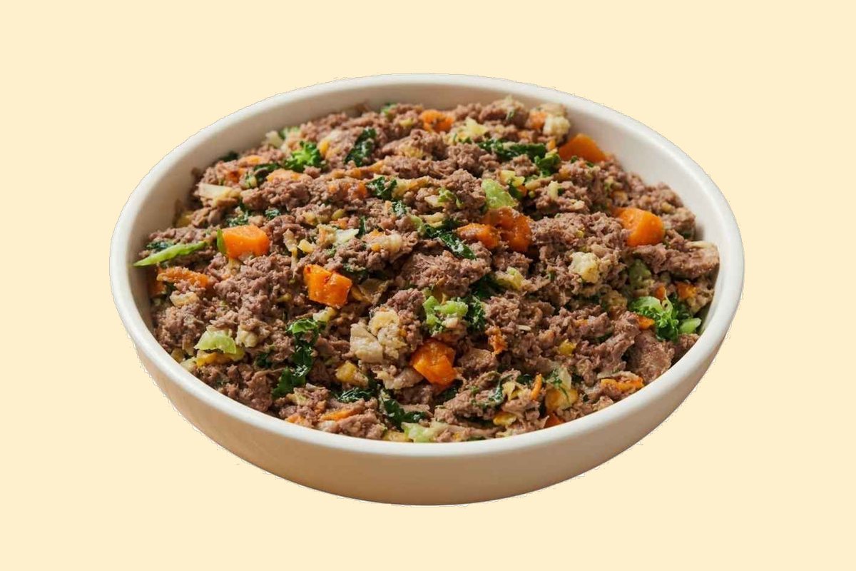 A bowl of cooked ground kangaroo with kale, carrots, butternut squash and brown rice